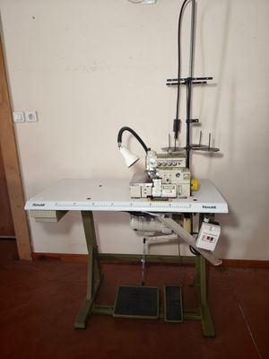 a sewing machine sitting on a table in a room