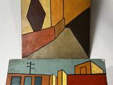 two paintings of a building and a building on a white surface