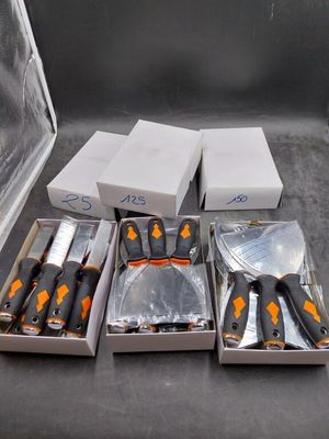 many knives and knives in a box on a table