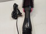 a hair dryer and a blow dryer on a table