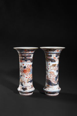 pair of chinese vases on a black background