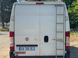 a white van that is parked on the side of the road