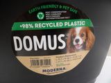 a black container with a dog on it and a sticker on the lid