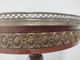 a wooden table with a metal tray on it