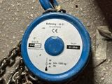 a blue and white fire hydrant sitting on the ground