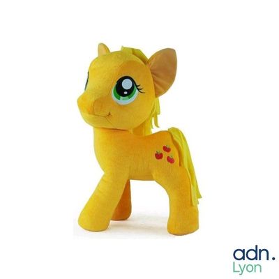 a yellow pony that is sitting on a white surface