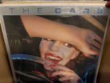 a picture of a picture of a woman holding a steering wheel