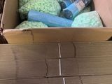 a cardboard box filled with assorted items on a table