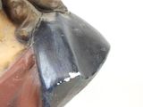 a close up of a statue of a man with a hat on