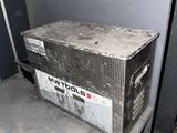 a metal box sitting on top of a table in a room
