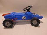 a blue toy car with a steering on a white surface