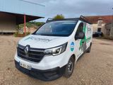 a white van that is parked in front of a building
