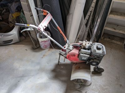 a small machine that is sitting in the garage
