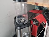 a blender sitting on top of a counter next to a blender
