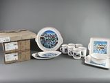 many different types of dishes and cups on the table