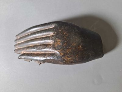 a metal fork with a metal handle on a table