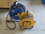 two reels that are sitting on the floor