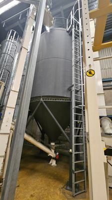 a large metal tank that is inside of a building