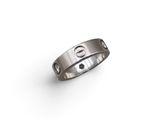 a close up of a ring on a white surface