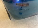 a close up of a car ' s bumper with a sticker on it