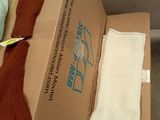 a cardboard box with a pair of gloves and a pair of mittens