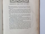 an open book with a picture of a clock on it