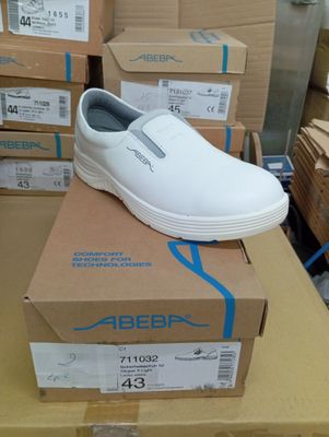 a white shoe that is on top of a box