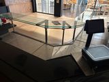 a glass counter in the middle of a store