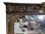 a mirror that is sitting on the floor in front of a mirror