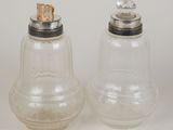 pair of glass salt and pepper shakers with cork stoppers
