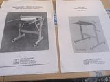 two pages of manuals on a table that are sitting on a table