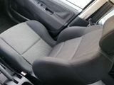 a picture of the inside of a car with the seat up