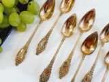 a lot of spoons that are sitting on a table