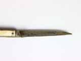 a knife that is laying on a table