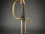 a gold and silver sword with a snake on the handle