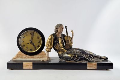 a statue of a woman sitting on a table next to a clock