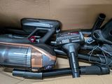 a box with a bunch of vacuums and other items in it