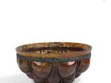 an image of a brown bowl sitting on top of a white surface