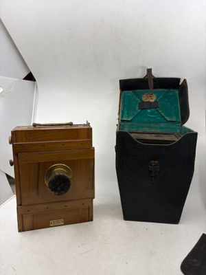 three different types of cameras sitting on a white surface