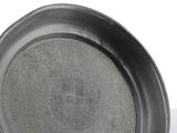 a close up of a metal cup on a table