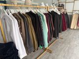 a rack of clothes on a clothes rack in a clothing store