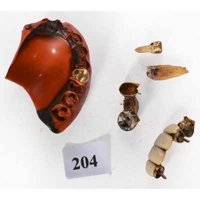 several pieces of pottery are displayed on a white surface