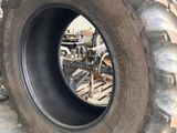 a tire that is sitting in the middle of a pile of tires