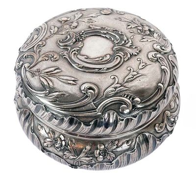 an image of a silver box with a floral design on it