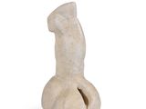 a small statue of a horse that is sitting on a white surface