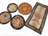four plates and a rug on the table