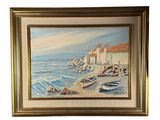 tableau à l'huile encadré représentant une scène de plage avec des bateaux et des bâtiments