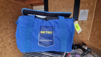 a blue tote bag with a metro logo on it