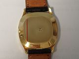 a watch that is sitting on a white surface