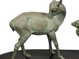 statue of a deer and a baby deer on a black base